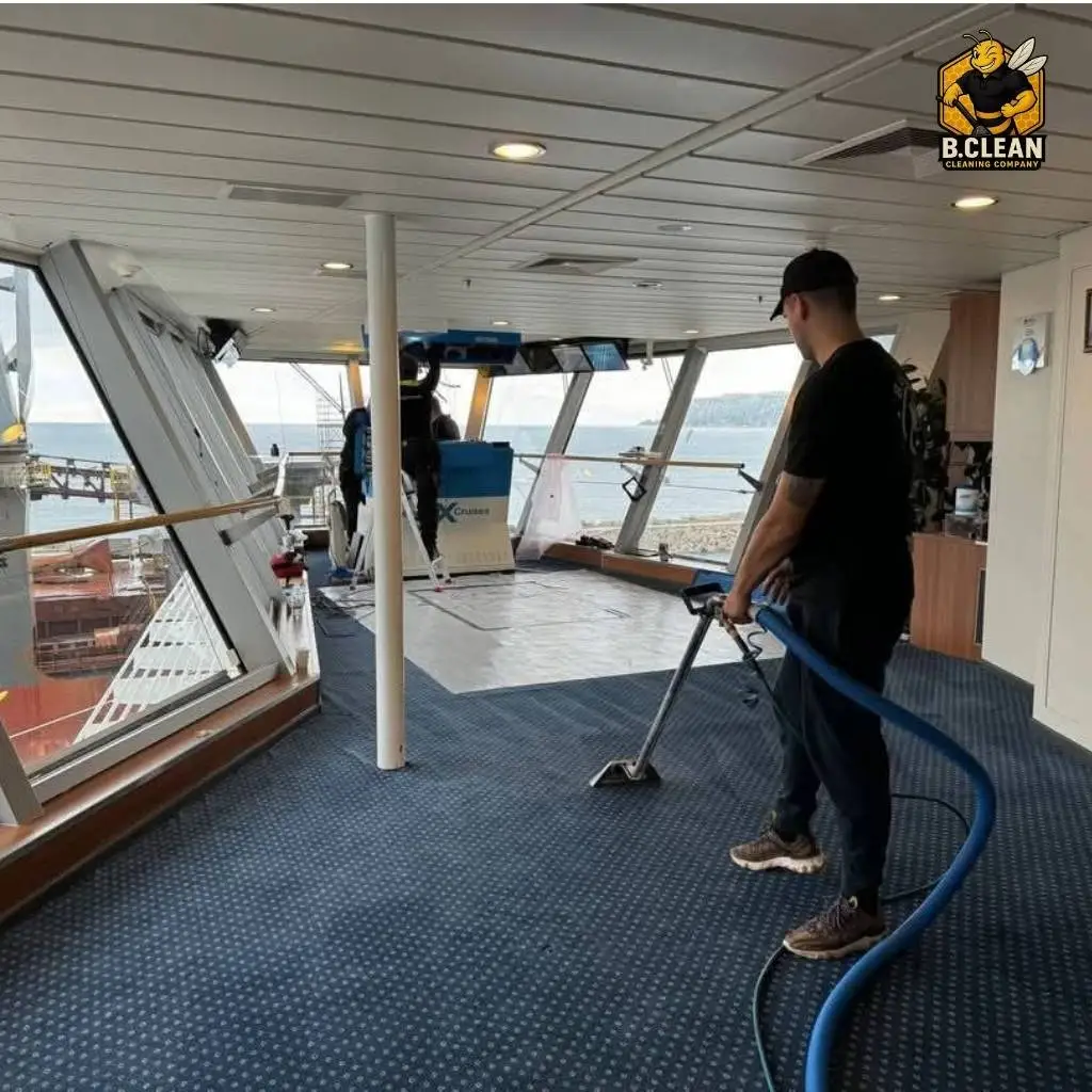 Channel 5s Brennan Budden of Filthy House SOS with carpet cleaning machine cleaning blue carpets as part of commercial cleaning in Kent by B Clean Cleaning