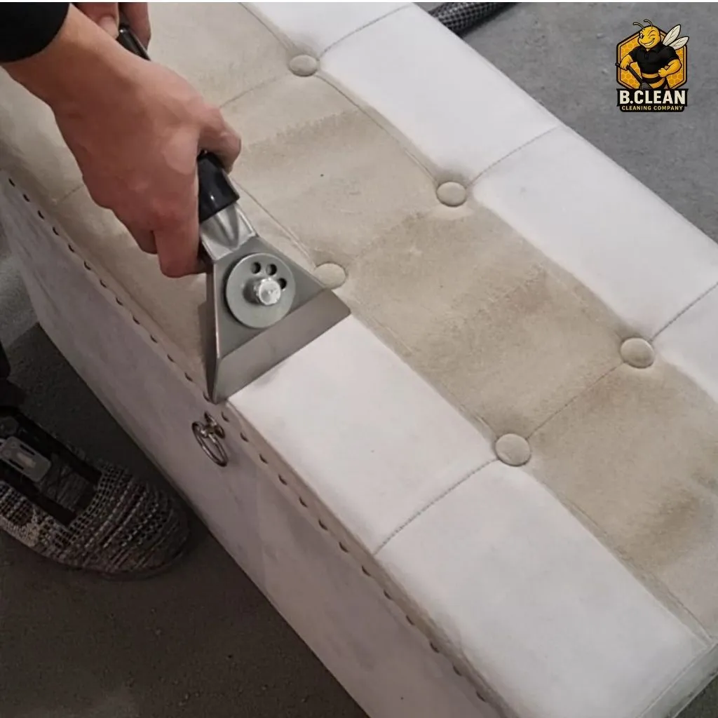 Channel 5s Brennan Budden of Filthy House SOS highlighting before and after clean of ottoman. Showing how dirty the fabric was in the centre and how pristine it gets as part of sofa & Upholstery cleaning in Kent by B Clean Cleaning
